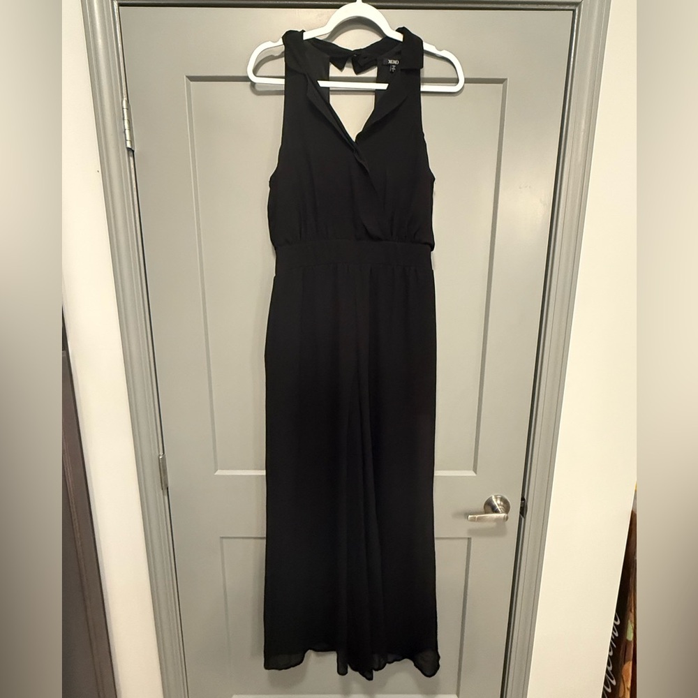 Black wide leg, backless, jumpsuit.